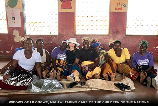 Veronica with widows of Lilongwe, Malawi taking care of The Children Of The Nations.